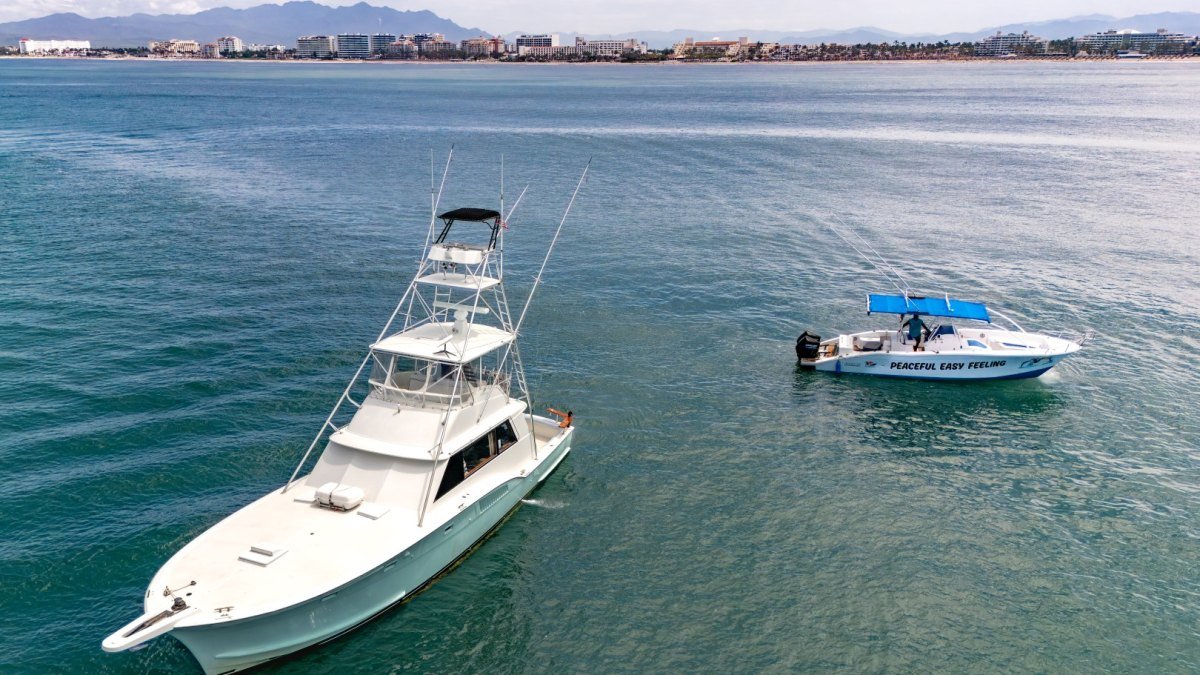 Steel n Time and Peaceful Easy Feeling anchored in Banderas Bay with the Nuevo Vallarta hotel zone on the shoreline behind